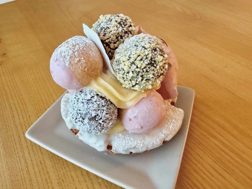 Left side view of the Ditto Donut Tree with pink donut topping and cream layers