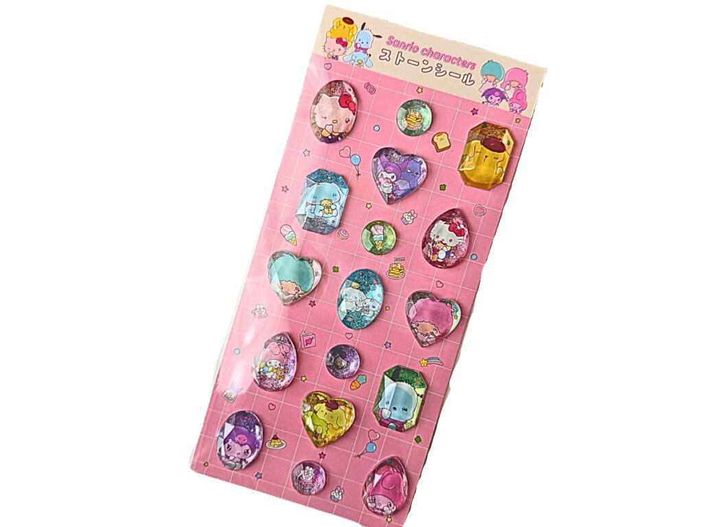 サンリオキャラクターズのストーンシール キディランド入荷 ピンク背景の立体シール