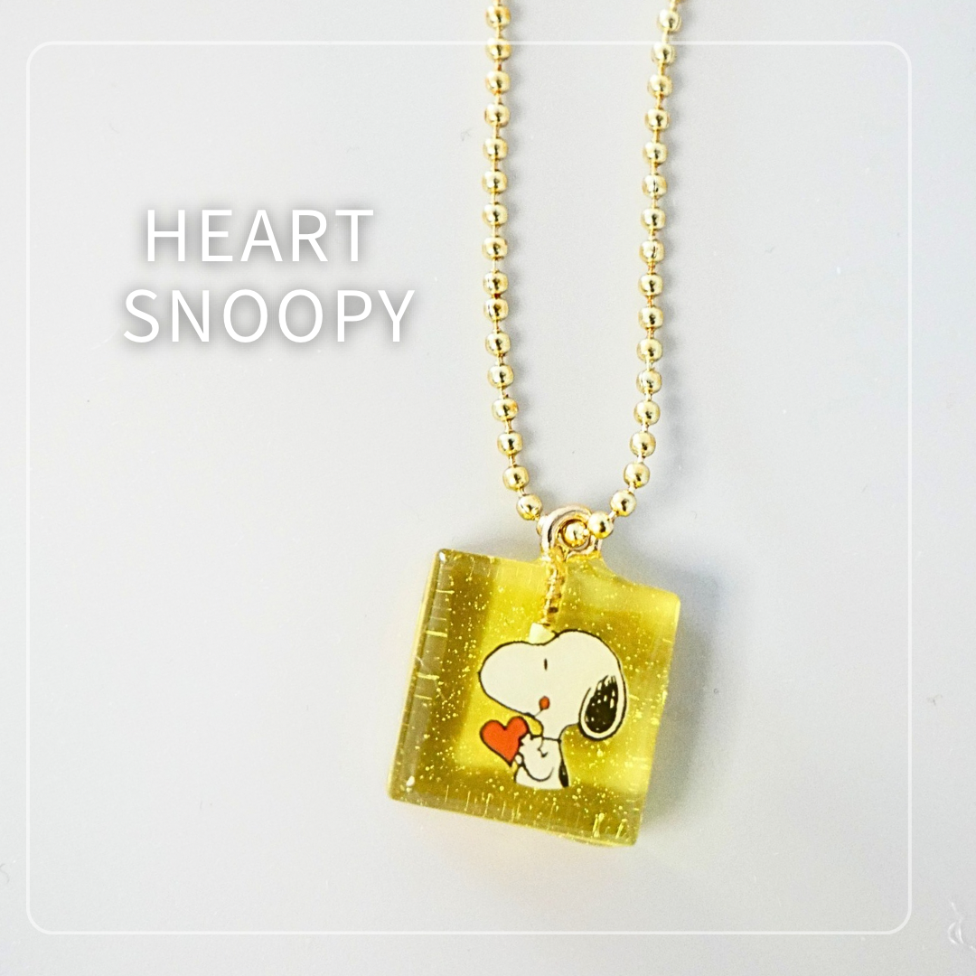 Mini heart-shaped Snoopy resin charm in soft pink