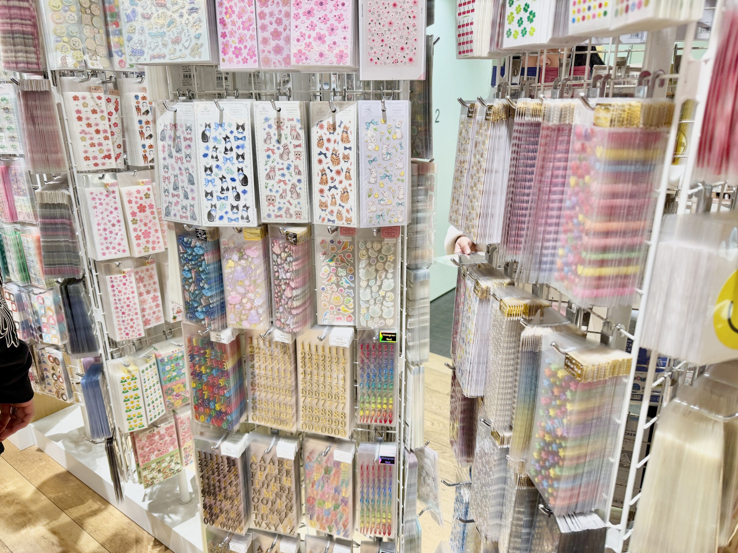 Sticker section in a Japanese stationery store with colorful decorative stickers on display